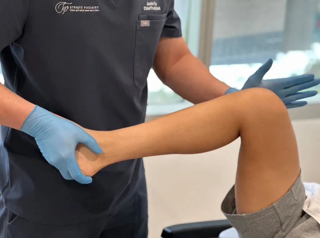 podiatrist performing Meniscus tear test and assessment