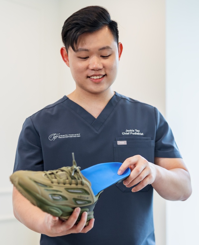 Podiatrist advising feet patient during clinical consultation