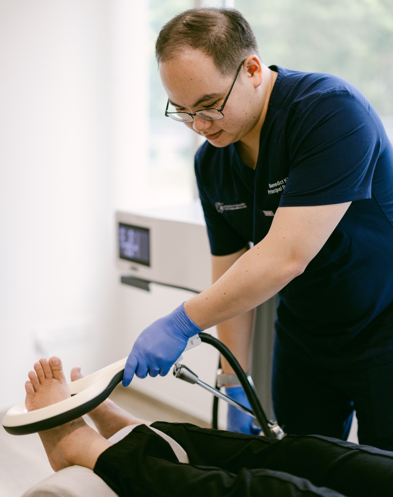 Podiatrist Performing Extracorporeal Magnetotransduction Therapy